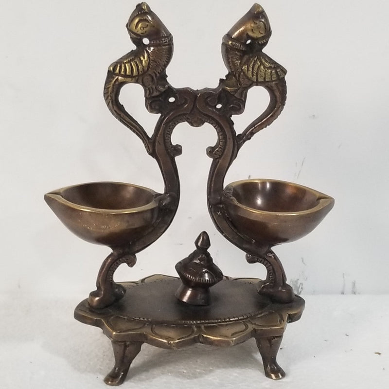 7"H x 4.5"W x 3"D - Handcrafted Brass peacock inspired double lamp